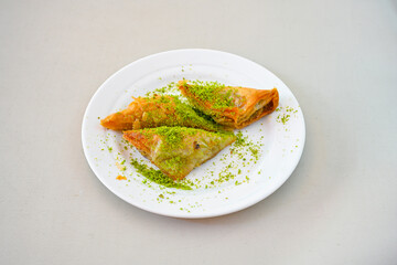 Turkish Dessert Sobiyet, havuc dilimi, midye baklava, mussels baklava and classic baklava with Pistachio . Cikoltali cevizli, fistikli soguk Baklava, top view.