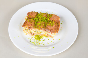 Turkish Dessert Sobiyet, havuc dilimi, midye baklava, mussels baklava and classic baklava with Pistachio . Cikoltali cevizli, fistikli soguk Baklava, top view.