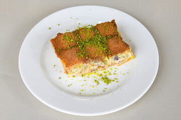 Turkish Dessert Sobiyet, havuc dilimi, midye baklava, mussels baklava and classic baklava with Pistachio . Cikoltali cevizli, fistikli soguk Baklava, top view.