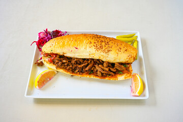 Meat, chicken shawarma kebab with yogurt and fried butter sauce .Tantuni Special. Yogurtlu Mersin...