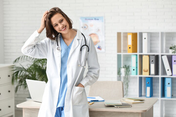 Beautiful female doctor with stethoscope in clinic