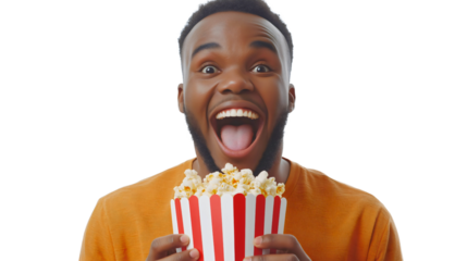 Excited young African American man holding popcorn bucket with surprised expression showing entertainment and movie theater experience