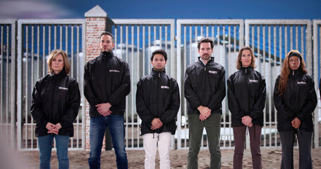 Diverse team of security guard officers safeguarding facility entrance
