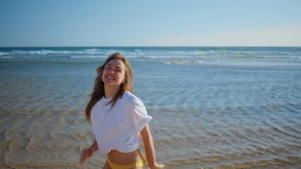 Fototapeta premium Overjoyed woman rejoicing sea vacation closeup. Joyful model looking camera