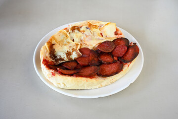 Turkish karisik atom Ayvalik tost ( kasarli bazlama tost) . Sucuklu, Kasarli, kavurmali karisik tost. Flat baked bread toasted. Karisik bazlama tost .  