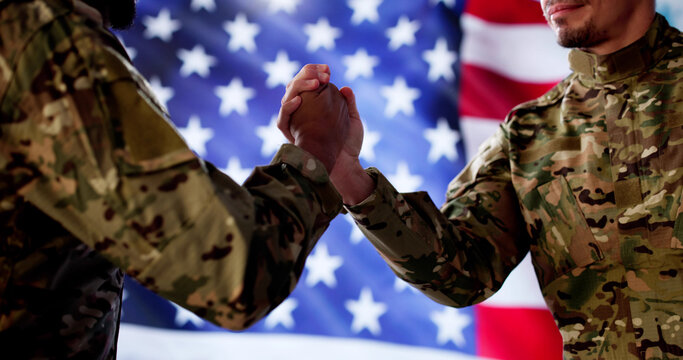 Young African American soldier shaking hands, Peace treaty signed, war end