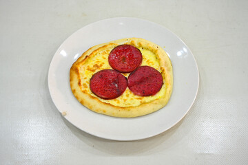 Kiymali pide.Turkish pide with minced meat. Turkish pizza mince pita Pide on white . Etli ekmek.Kusbasi kasarli, kiymali kasarli, kiymali yumurtali, Bafra, Trabzon, Kusbasili pide. Urfa acili lahmacun
