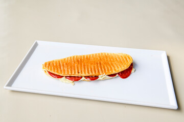 Turkish karisik atom Ayvalik tost ( kasarli bazlama tost) . Sucuklu, Kasarli, kavurmali karisik tost. Flat baked bread toasted. Karisik bazlama tost .  