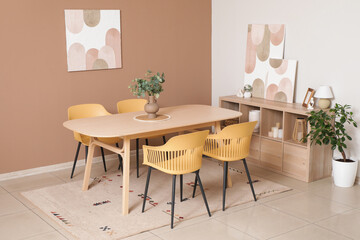 Dining table with chairs in interior of room