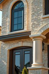 Fototapeta premium Elegant Home Exterior with Classic Columns and Brick Facade. Luxury Real Estate, Modern Architecture, and Residential Design.