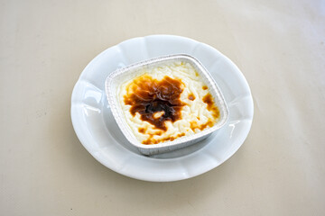 Baked rice pudding turkish milky dessert sutlac, keskul  (Turkish name; firin sutlac). Findikli Hamsikoy Sutlac