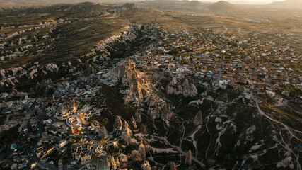 The Famous Uchhisar Cave Castle In Cappadocia, At Sunset, Turkey, Aerial View