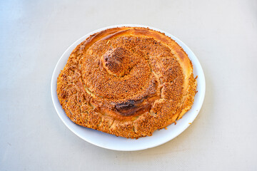 On the table, pita bread with honey, walnuts and tahini. Tahinli , ceviz ve balli pide.