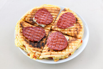Turkish karisik atom Ayvalik tost ( kasarli bazlama tost) . Sucuklu, Kasarli, kavurmali karisik...