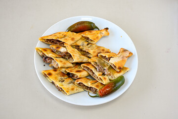 Kiymali pide.Turkish pide with minced meat. Turkish pizza mince pita Pide on white . Etli ekmek.Kusbasi kasarli, kiymali kasarli, kiymali yumurtali, Bafra, Trabzon, Kusbasili pide. Urfa acili lahmacun