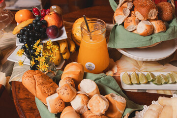 Large family table with a variety of foods to grab.