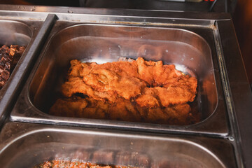 Milanese to be served in a buffet restaurant.