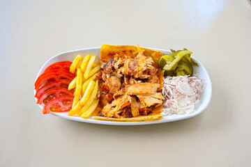 Lavash zurna doner kebab ( zurna  durum )  or shawarma sliced in plate isolated.  hatay usulu tavuk Et doner durum. Gobit ekmek arasi doner. Pilavustu iskender doner kebap. 