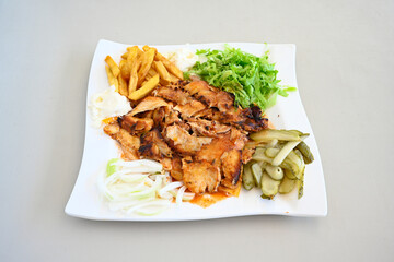 Lavash zurna doner kebab ( zurna  durum )  or shawarma sliced in plate isolated.  hatay usulu tavuk Et doner durum. Gobit ekmek arasi doner. Pilavustu iskender doner kebap. 