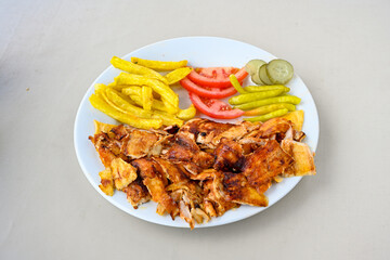 Lavash zurna doner kebab ( zurna  durum )  or shawarma sliced in plate isolated.  hatay usulu tavuk Et doner durum. Gobit ekmek arasi doner. Pilavustu iskender doner kebap. 