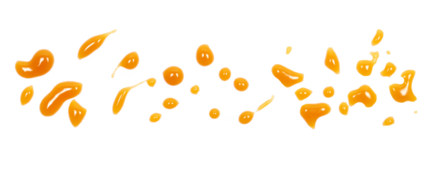 Dessert sauce droplets, caramel flavored topping isolated on white	