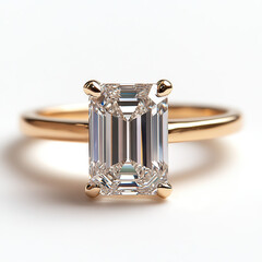 golden ring ith emerald cut diamond