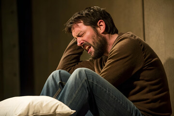 Obraz premium A Person Crying On Floor In Interior Setting Performance During Drama Recital