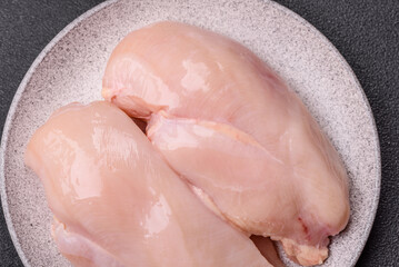 Raw chicken or turkey fillet with salt, spices and herbs