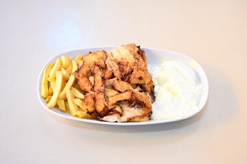 Lavash zurna doner kebab ( zurna  durum )  or shawarma sliced in plate isolated.  hatay usulu tavuk Et doner durum. Gobit ekmek arasi doner. Pilavustu iskender doner kebap. 