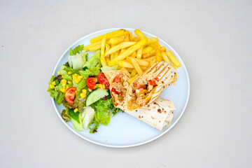 Lavash zurna doner kebab ( zurna  durum )  or shawarma sliced in plate isolated.  hatay usulu tavuk Et doner durum. Gobit ekmek arasi doner. Pilavustu iskender doner kebap. 