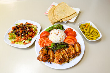 Chicken wings barbeque in a dish with BBQ grill sauce . Izgara tavuk kelebek sis kanat. Izgara tavuk sis, gogus.