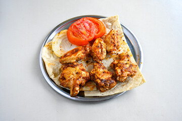 Chicken wings barbeque in a dish with BBQ grill sauce . Izgara tavuk kelebek sis kanat. Izgara tavuk sis, gogus.