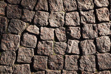 Texture of weathered stone road as background