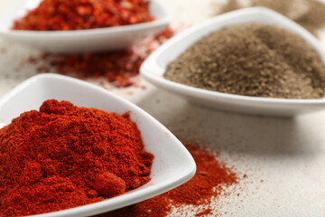 Plates with fresh spices on light background, closeup