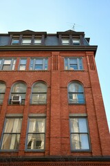 Fototapeta premium Red Brick Rowhouse with Dormer Windows (New York, New York, USA) 