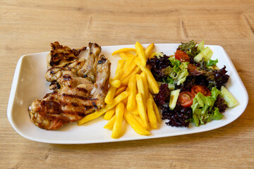 Chicken wings barbeque in a dish with BBQ grill sauce . Izgara tavuk kelebek sis kanat. Izgara tavuk sis, gogus.