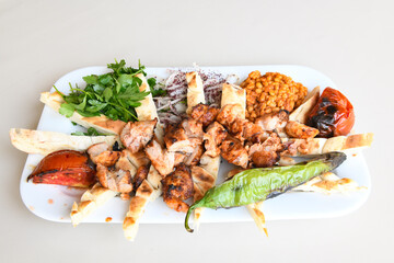 Chicken wings barbeque in a dish with BBQ grill sauce . Izgara tavuk kelebek sis kanat. Izgara tavuk sis, gogus.