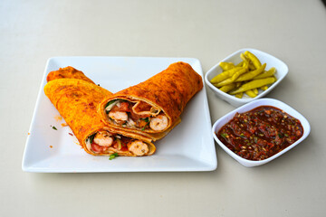 Lavash doner kebab ( soslu kasarli zurna doner durum )  or shawarma sliced in plate isolated.  Tavuk Et Doner Durum. Hatay Iskenderun usulu bazuka tavuk doner durum. 
