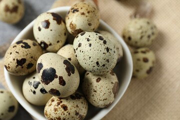 Quail eggs in a plate on burlap 