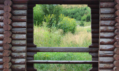 Nature Landscape Is Visible Through The Door Opening Of Log Cabin 
