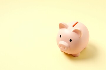 Piggy coin bank on colored background for money savings, financial security or personal funds concept.