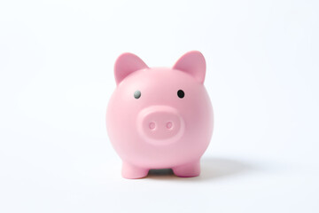 Piggy coin bank on white background for money savings, financial security or personal funds concept.