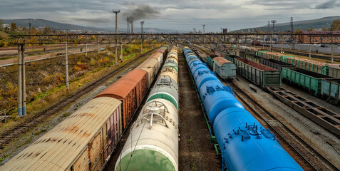 Transportation industry. LNG, gasoline and oil tanks. Railway Station with trains
