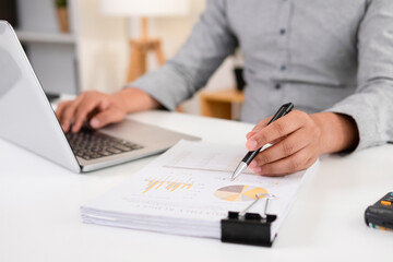 Businessman analyzing plans in the workplace