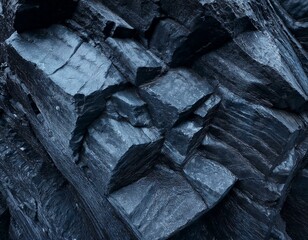Dark blue rock basalt texture. Rough mountain surface. Close-up. Stone background for design. 3D shape. Cracked collapse broken crumbled. Fantasy. Like cold frost ice.