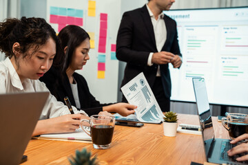 Project manager planning schedules for business task at meeting room, Gantt chart software show on...