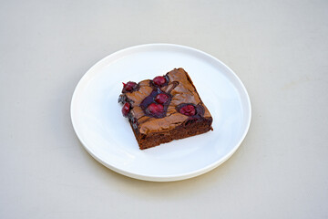 Delicious mosaic chocolate and biscuit cake served in a plate (Turkish name; Mozaik pasta or Mozaik kek). Brownie. Amerikan brownie, islak kek . 