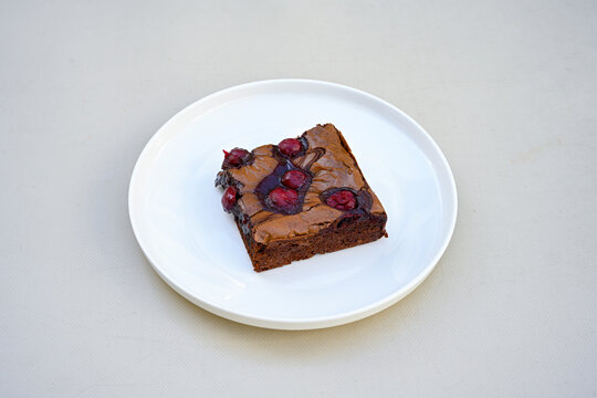 Delicious mosaic chocolate and biscuit cake served in a plate (Turkish name; Mozaik pasta or Mozaik kek). Brownie. Amerikan brownie, islak kek . 