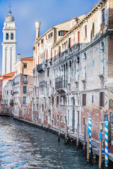 Old buildings in inland canals which are the waterways of Venice, Italy, 2019