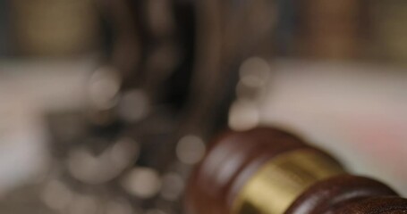 The video highlights justice via imagery of Lady Justice and a gavel - Powered by Adobe